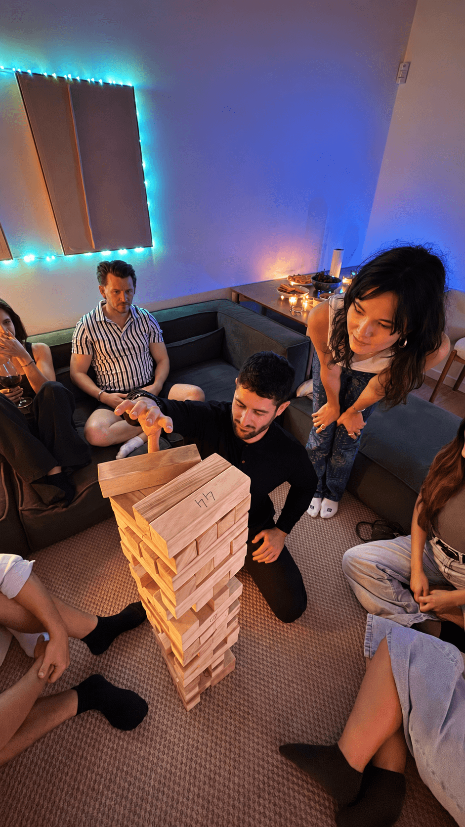 Looking down on the tower as block 44 comes out, friends on the sofa and the floor